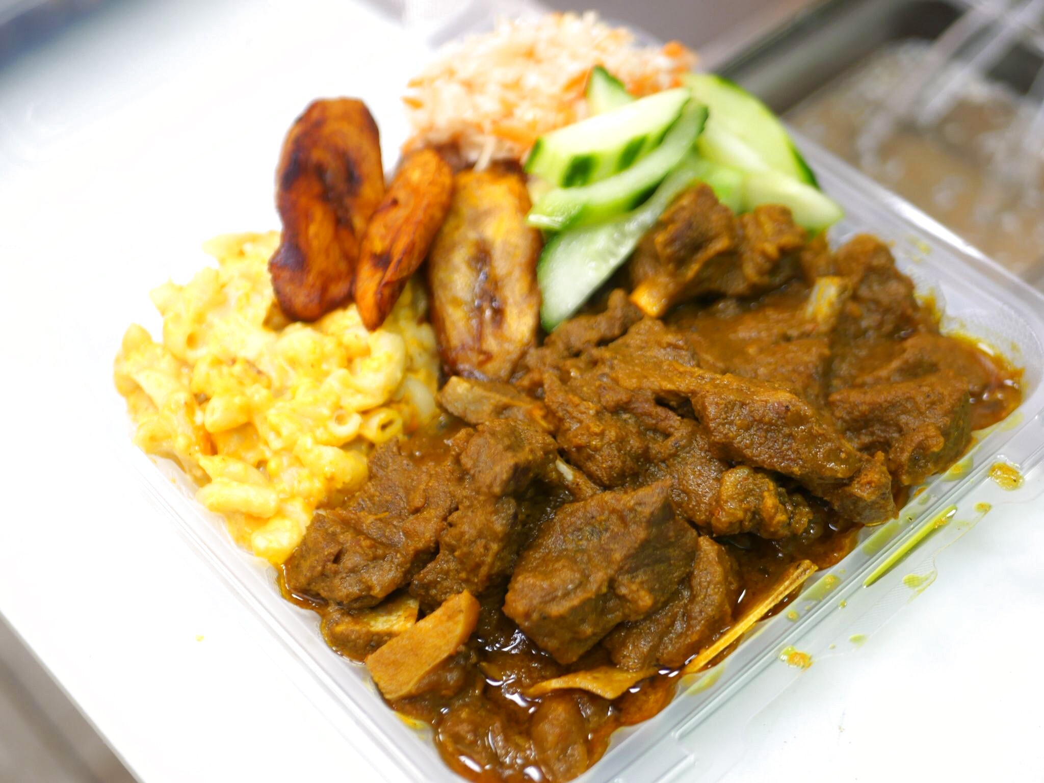 Curry goat plate at 9 Mile Toronto